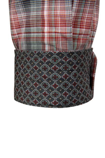 A close-up of a traditional shawl collar garment, featuring a red, white, and gray plaid upper section and a dark gray patterned lower band with a repeating geometric medallion design.