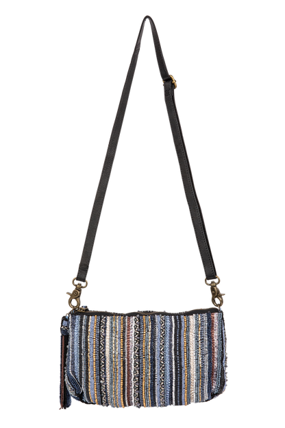 Multicolored striped bag with a black strap on a white background