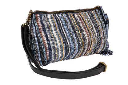 Multicolored striped handbag with a black strap on a white background