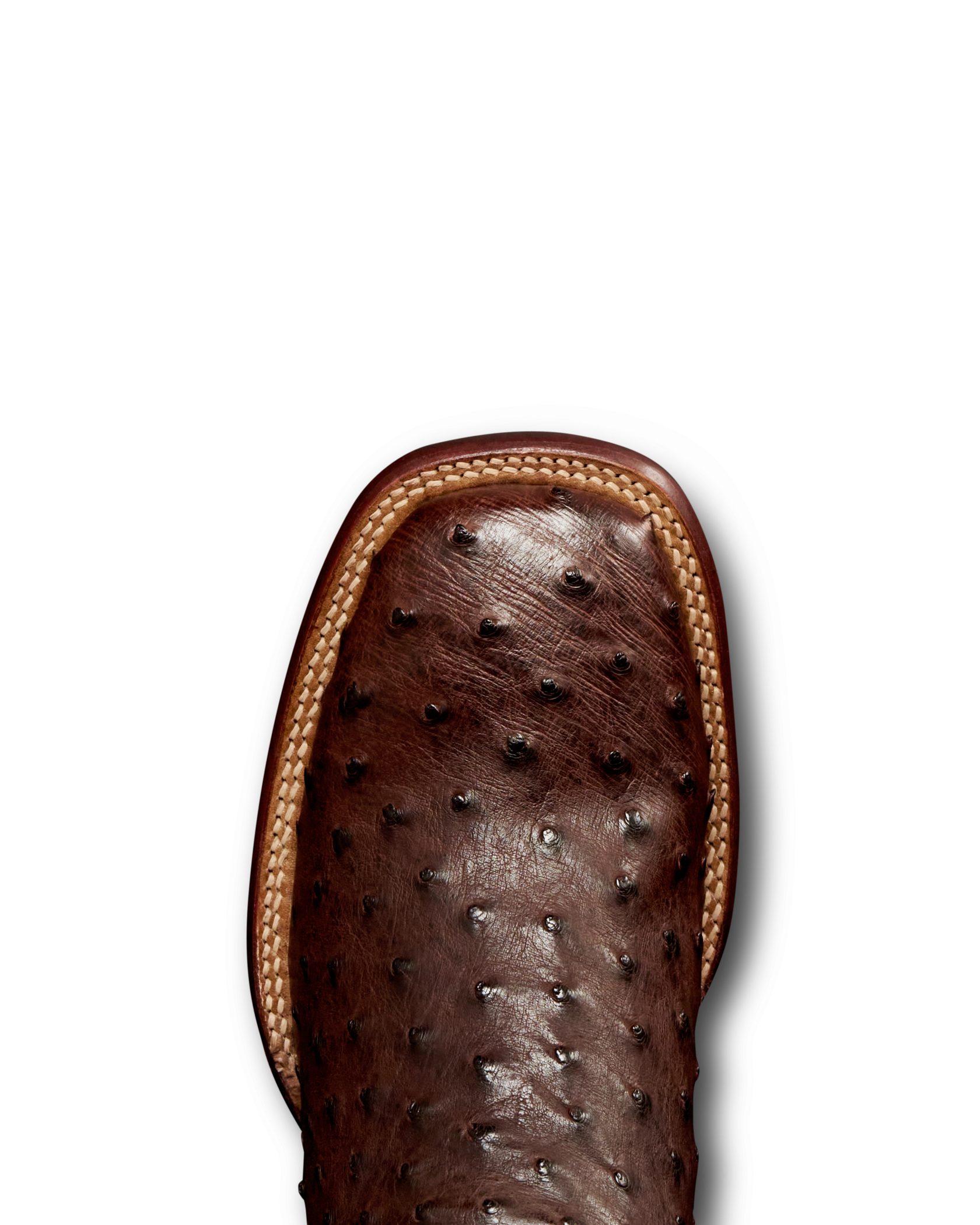 Close-up of the toe of a brown ostrich-textured leather boot