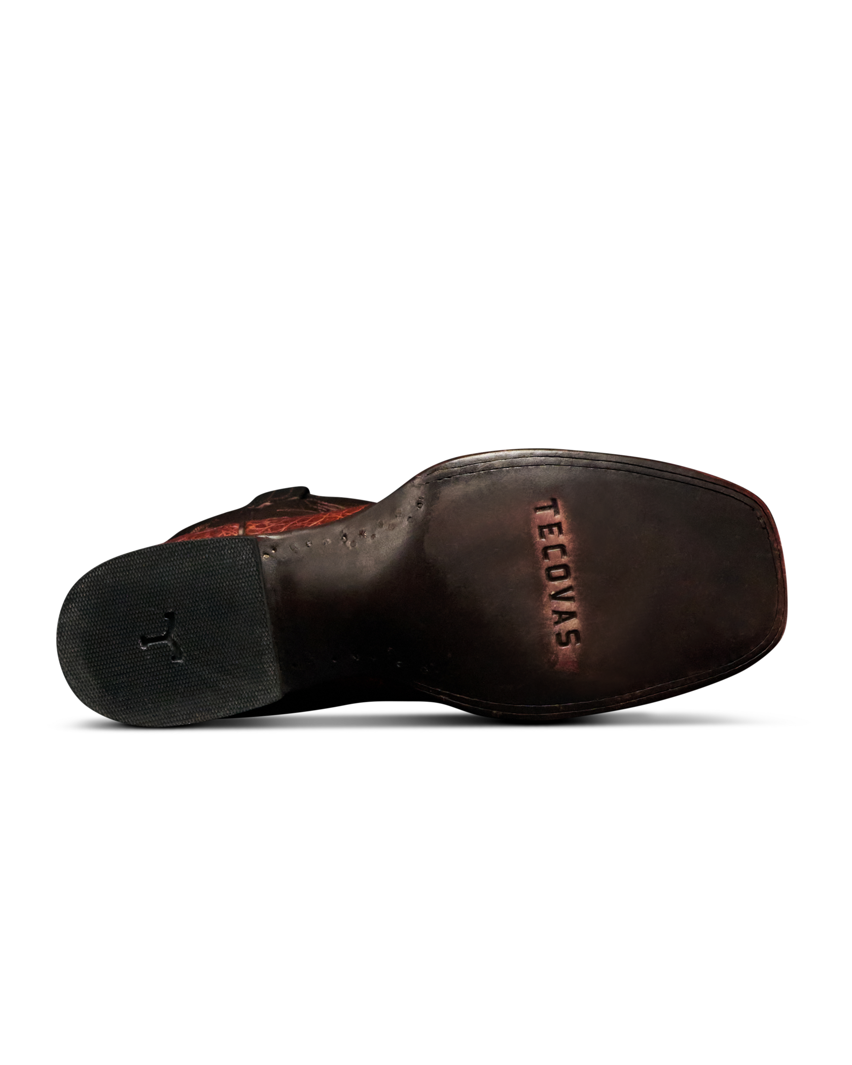 A close-up, bottom view of a dark brown leather boot sole, showing the brand name 'TECOVAS' embossed on the heel bed and a black rubber outsole.